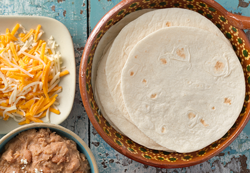 Tortillas, shredded cheese, refried beans!